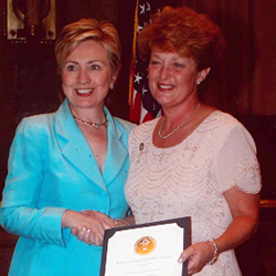 IU Nurse Patricia Gilchrist receiving the Jefferson Award for Public Service with then-First Lady Hillary Clinton.