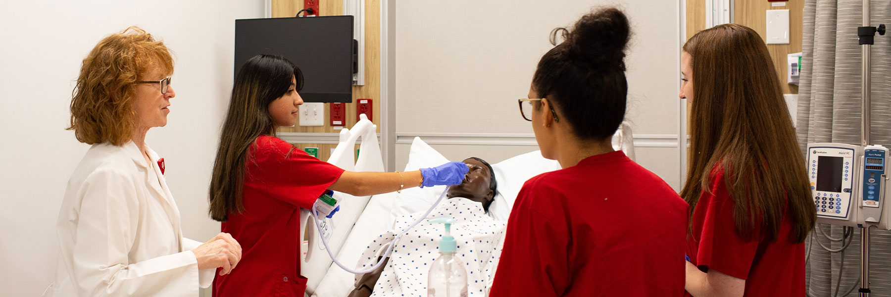 Nursing students with instructor at the Simulation and Skills Lab