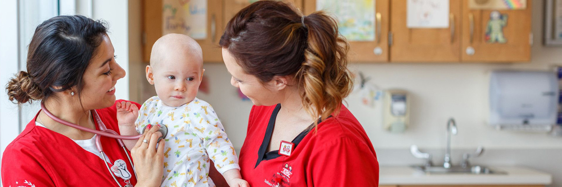 Nursing students with child