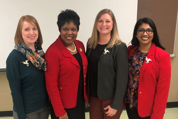 Eagles alumni pose for a photo with IU School of Nursing's Dr. Sharron Crowder