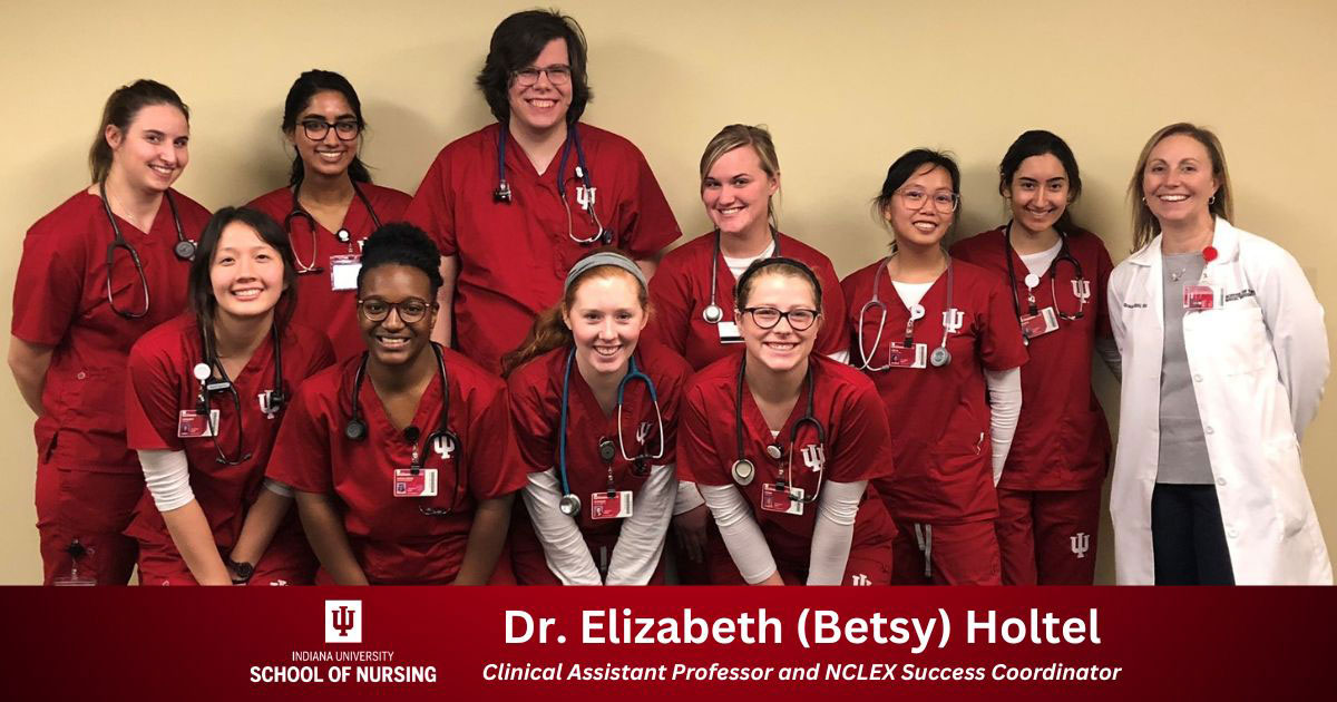 Dr. Elizabeth Holtel poses for a photo with IU School of Nursing students