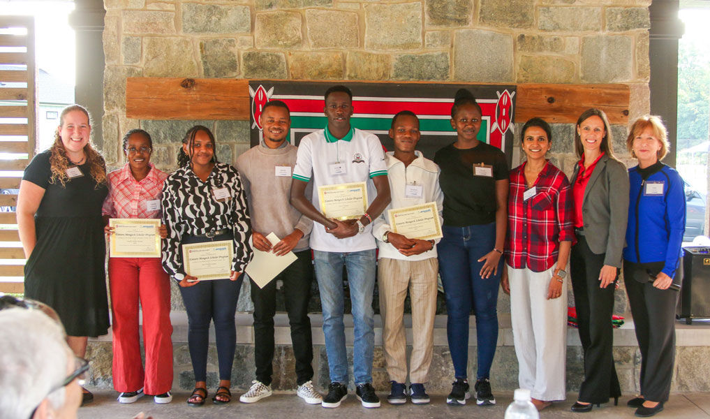 A group photo including Moi University students Victor Kiplagat and Olivia Watta during the AMPATH Ice Cream Social in Indianapolis.