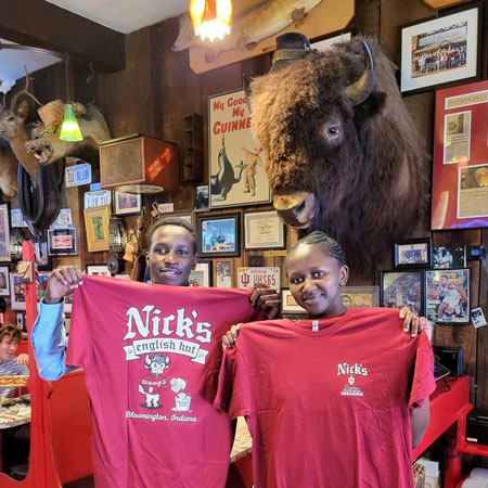 Moi University students Olivia Watta and Victor Kiplagat pose for a photo at Nick's English Hut