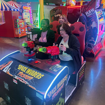 Moi University student Olivia Watta races Dr. Maria Hines during an afternoon outing at Crazy Pinz in Fort Wayne.