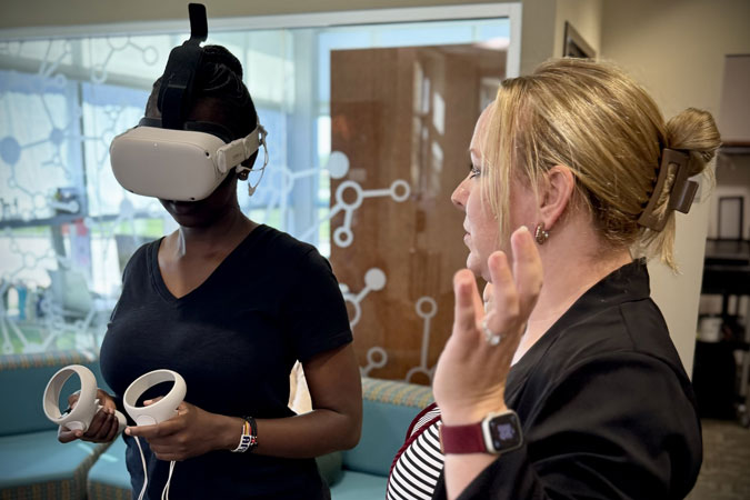 Moi University student Olivia Watta takes part in 3D simulations of caring for a patient at Parkview Health