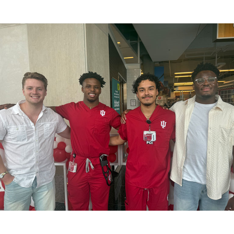 Group photo of four team members from the IUSON Pulse Racers, a 2024 IU Indianapolis Regatta team Group photo of four members of the IUSON Pulse Racers, a 2024 IU Indianapolis Regatta team