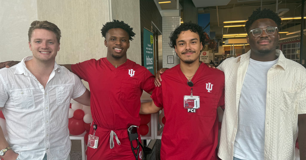 Group photo of four team members from the IUSON Pulse Racers, a 2024 IU Indianapolis Regatta team