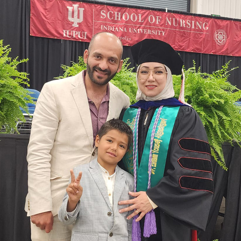 Dr. Elham Algashgari and family Photo of Dr. Elham Algashgari and family, quote from the article, and the IU School of Nursing logo