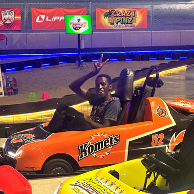 Moi University student Victor Kiplagat drives at go kart, a first for the student from Kenya, during a visit to Crazy Pinz in Fort Wayne.