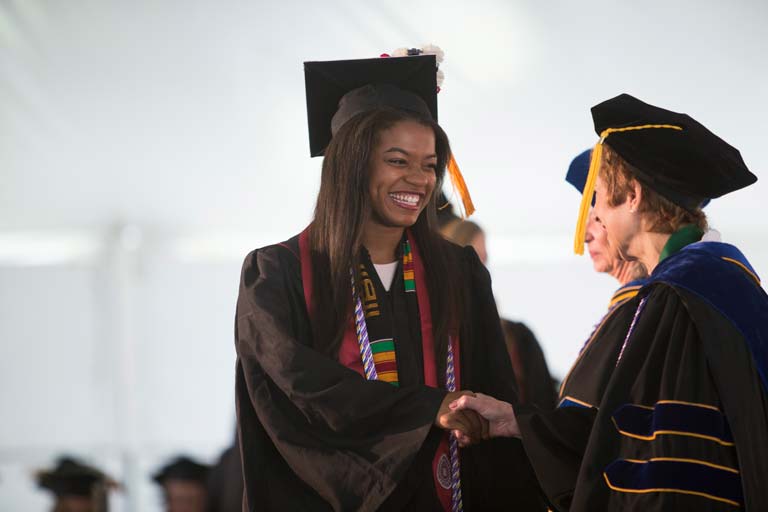 Graduate shaking hands with dean