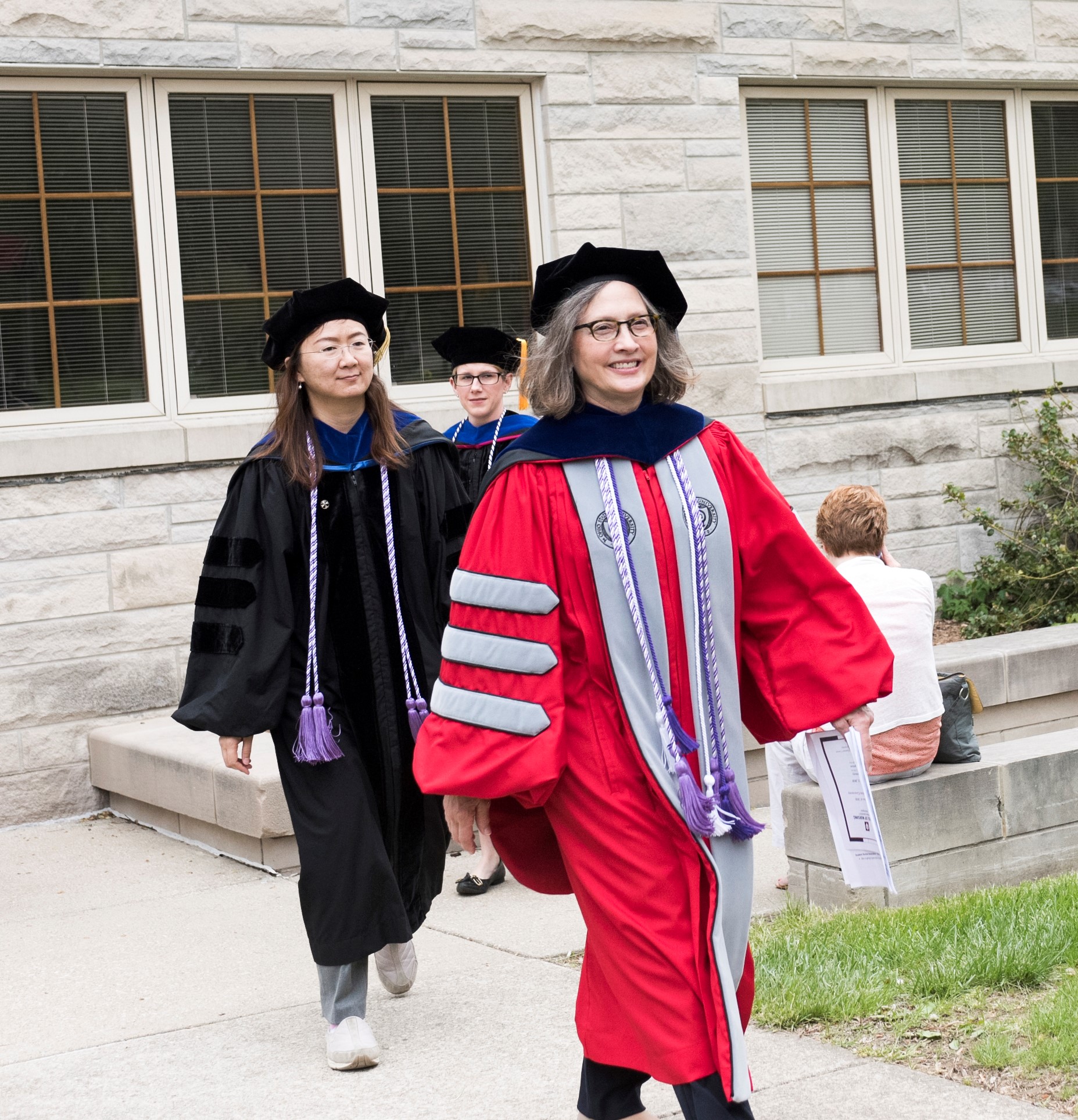 Associate dean and professors lead graduation procession