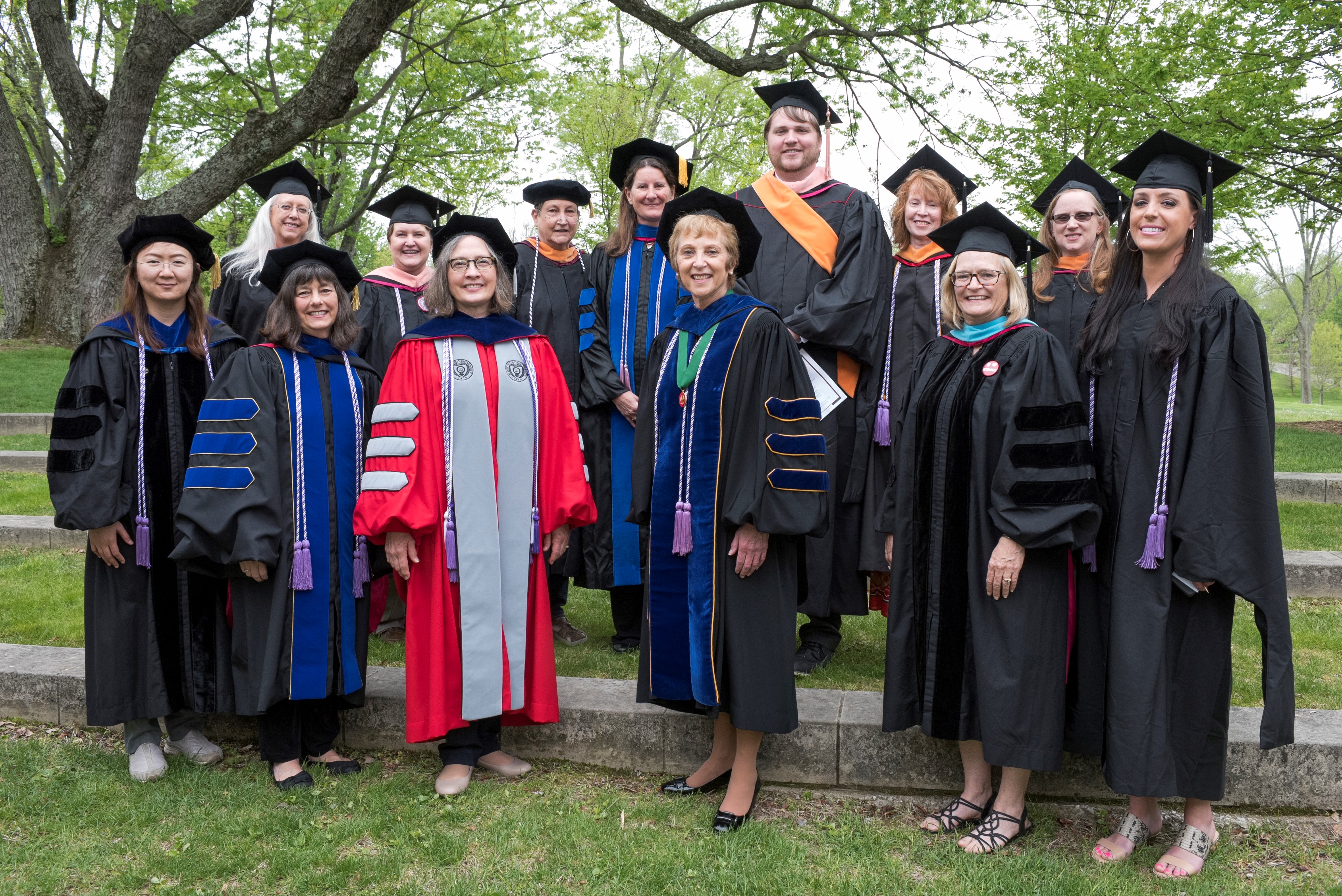 Group of faculty in caps and gowns