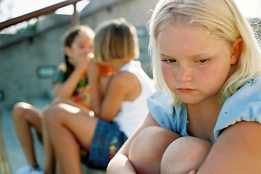 Young girl with downcast face