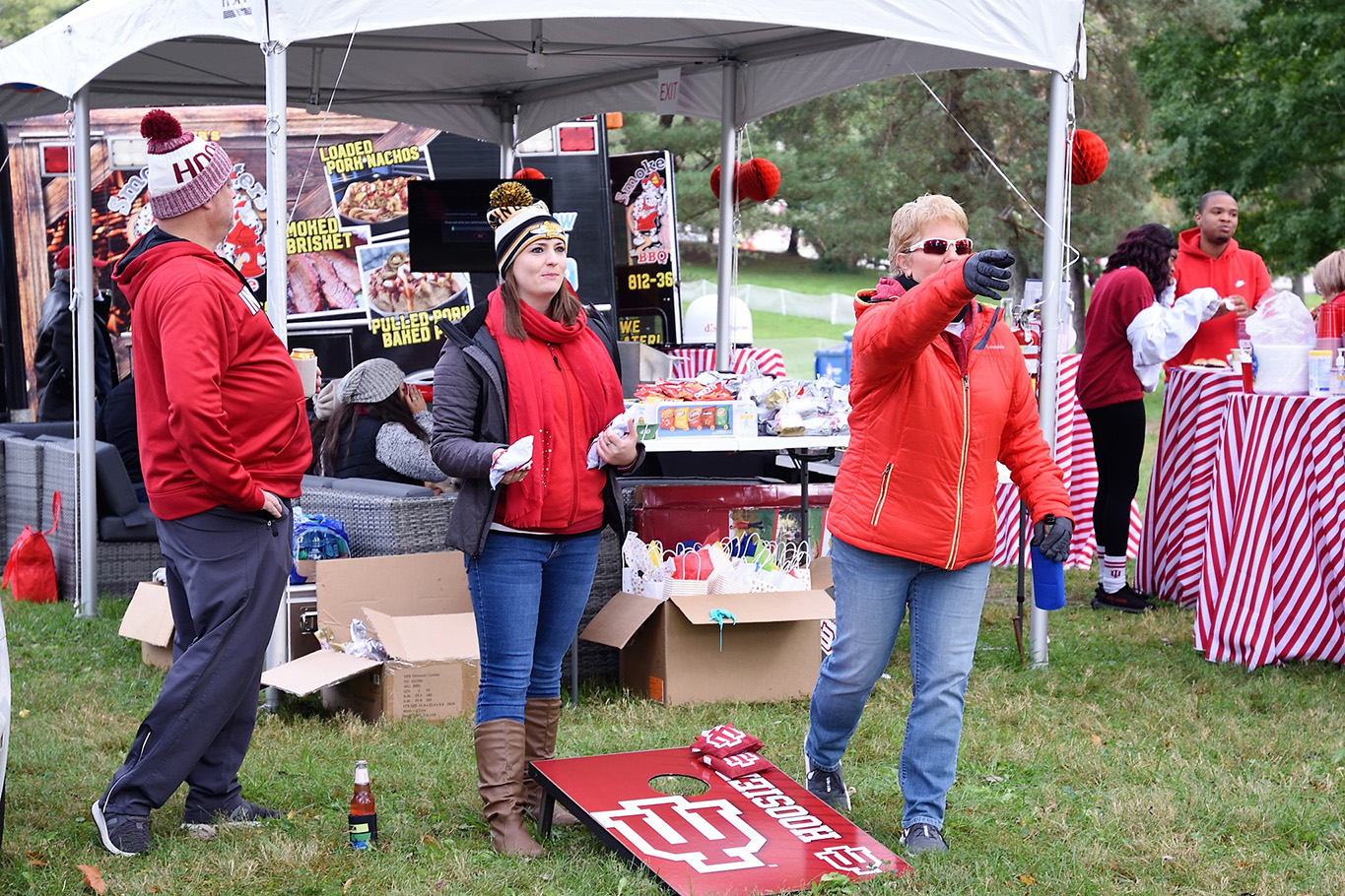 people playing cornhole at homecoming