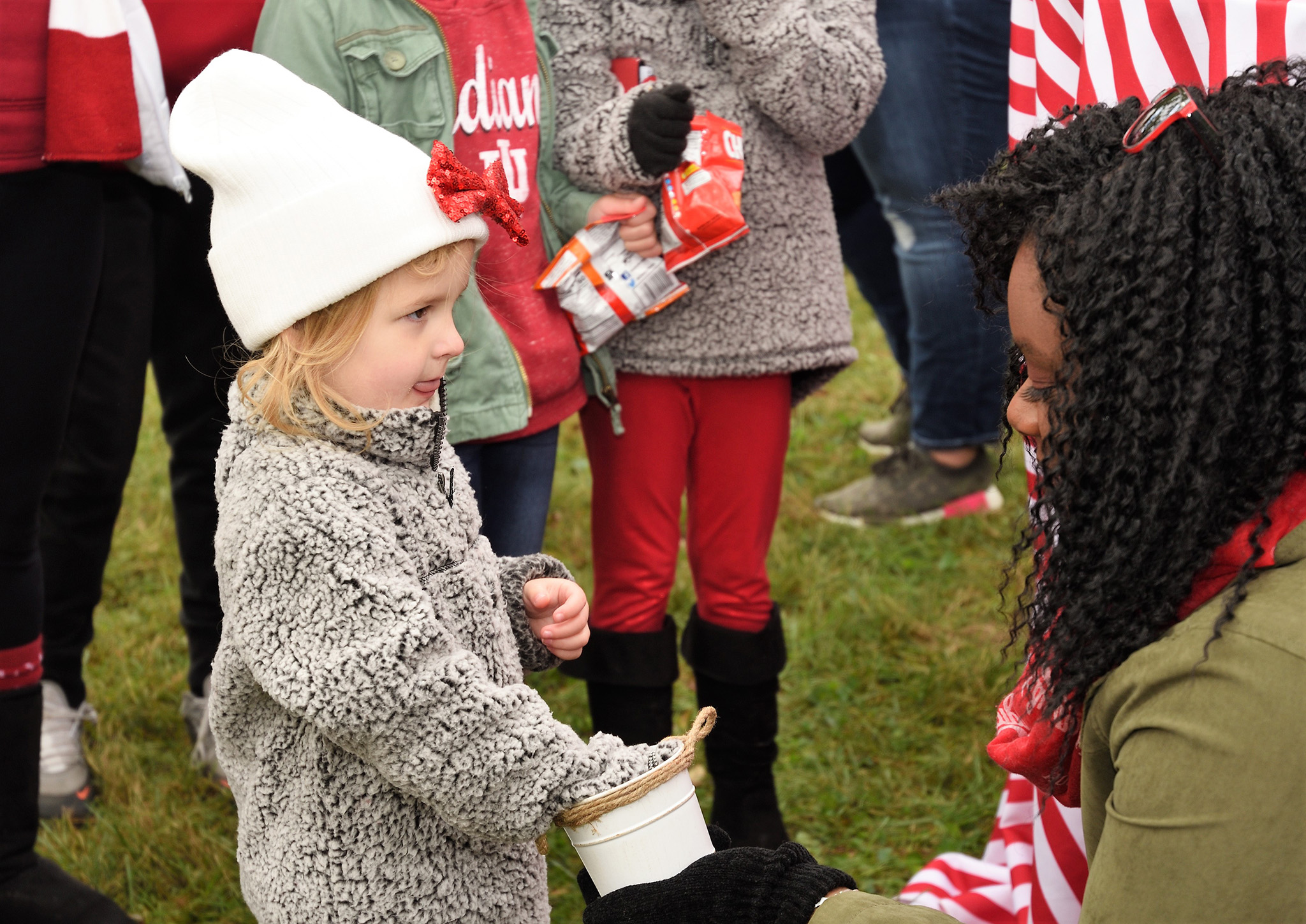 child at homecoming tailgate