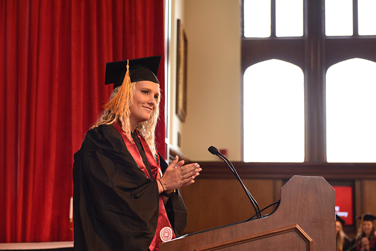graduate at podium