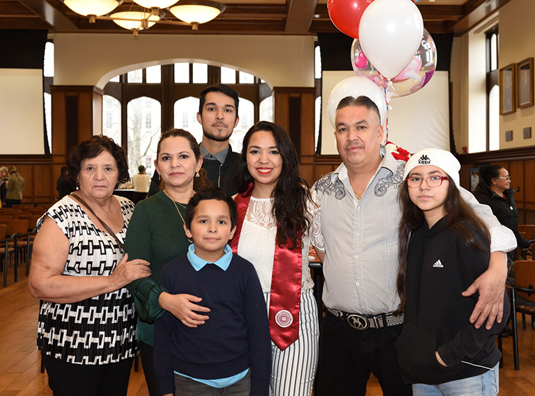 Family posing with graduate