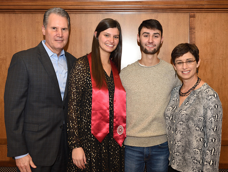 Family posing with graduate