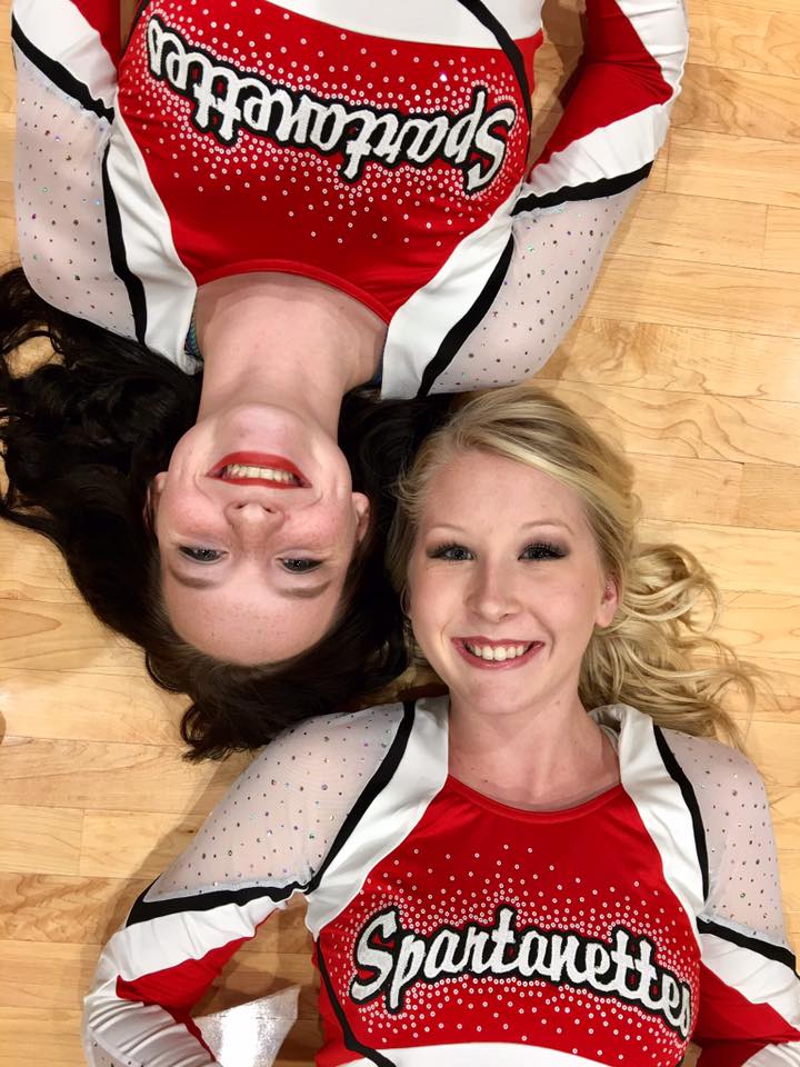 Two females lying on floor facing up to camera