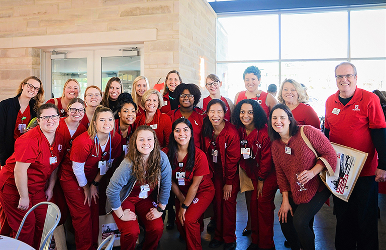 IUSON students in red scrubs