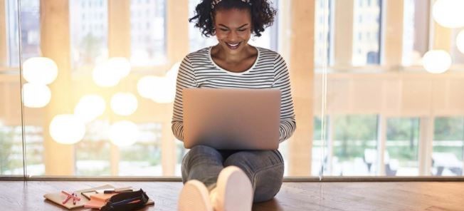 Student studying using  a laptop