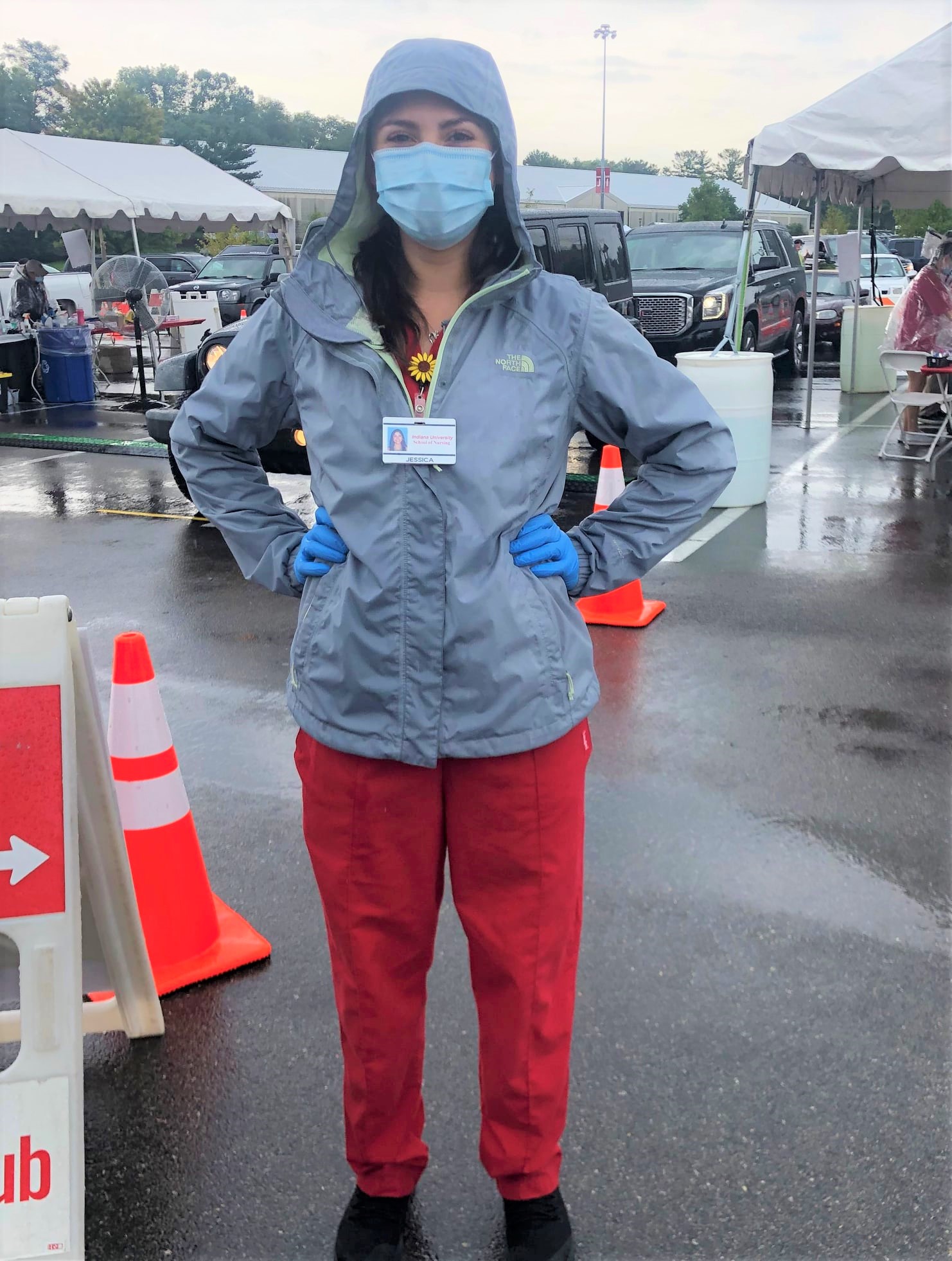 Woman in raincoat and protective mask