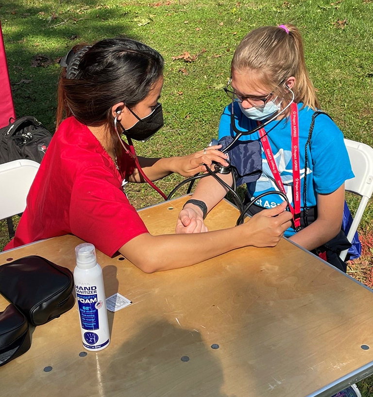 Two children using stethoscopes